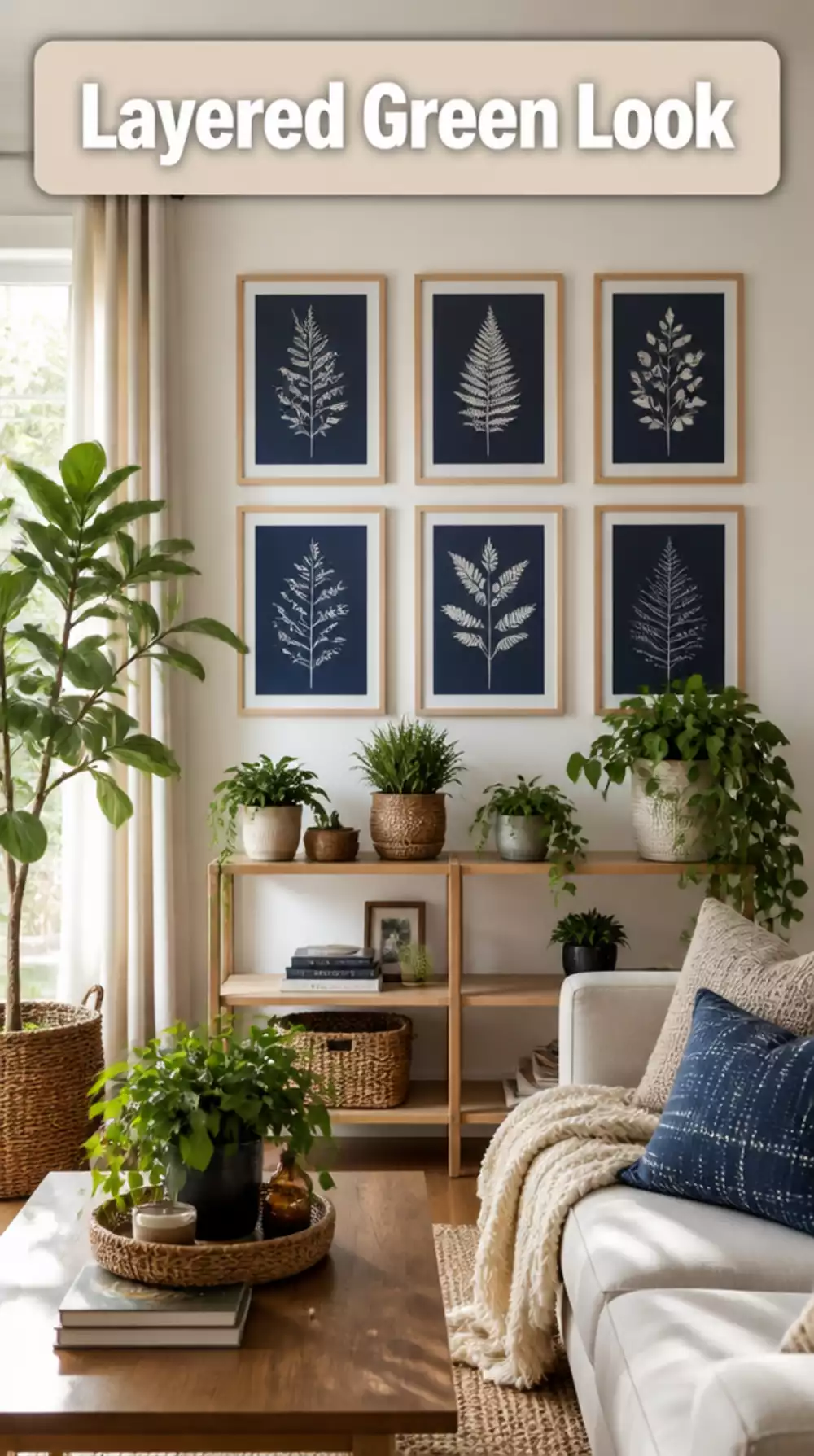 Layered botanical prints above a living room plant shelf